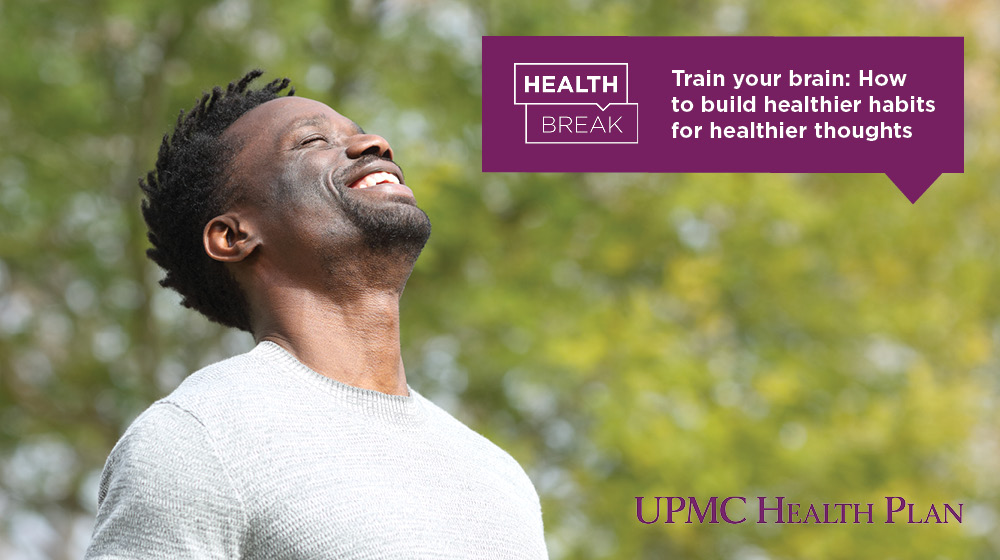 Person smiles towards the sun. Text overlaps with "Train your brain: How to build healthier habits for healthier thoughts"